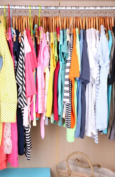 Colorful clothes in wardrobe — Stock Photo, Image