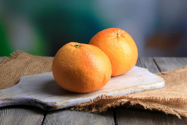 Ripe grapefruits on cutting board — Stock Photo, Image