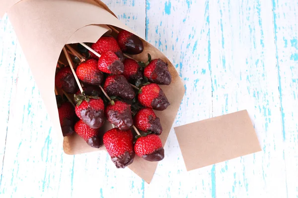 Strawberry in chocolate on skewers — Stock Photo, Image