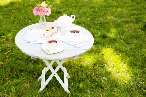 Coffee table with teacups — Stock Photo, Image