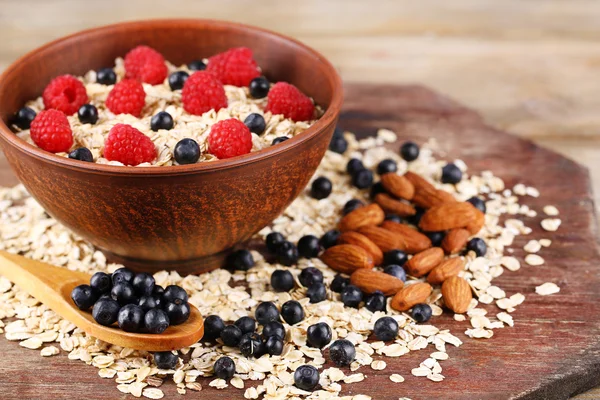 Big bowl with oatmeal and berries — Stock Photo, Image