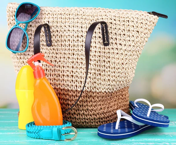 Summer wicker bag with accessories — Stock Photo, Image