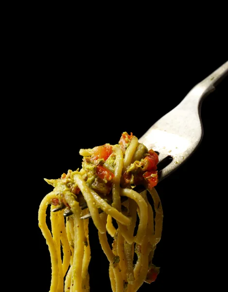 Italian pasta spaghetti on fork on black background — Stock Photo, Image