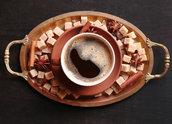 Brown sugar, spices and cup of coffee on tray, on wooden background — Stock Photo, Image