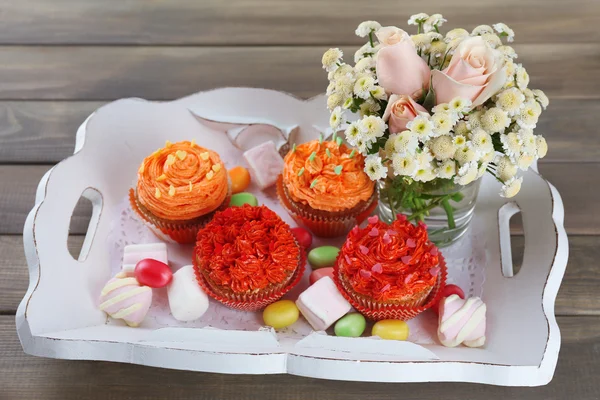 Tasty cupcakes on wooden table, close up — Stock Photo, Image