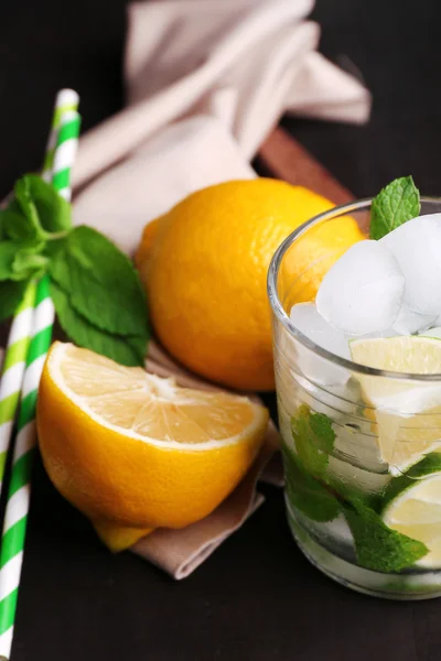 Fresh ingredients for mojito on old wooden table — Stock Photo, Image