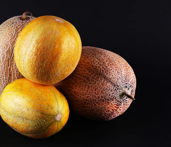 Melons isolated on black — Stock Photo, Image