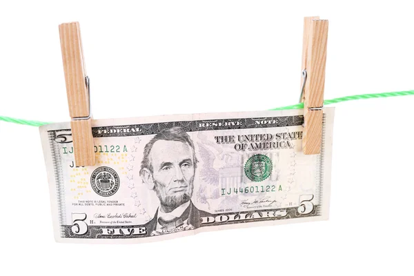 Dollar bill hanging on rope attached with clothes pins. Money-laundering concept. Isolated on white background. — Stock Photo, Image