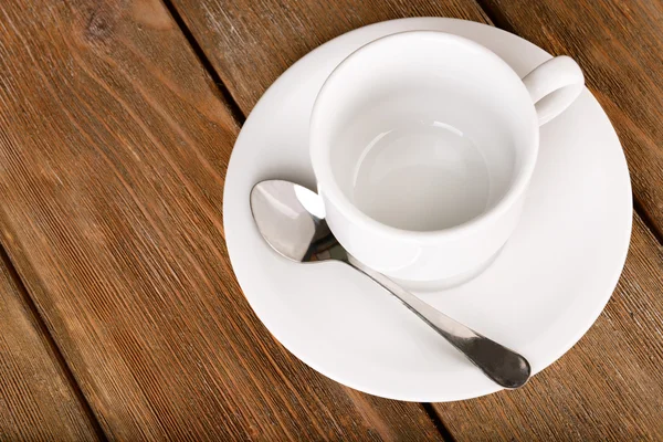 Xícara vazia com colher de chá — Fotografia de Stock
