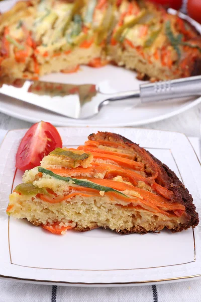 Piece of casserole with vegetables on plate on table close-up — Stock Photo, Image