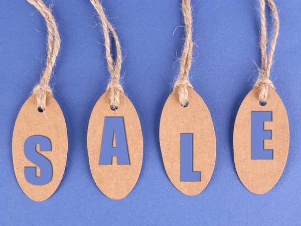 Sale tags on blue background — Stock Photo, Image