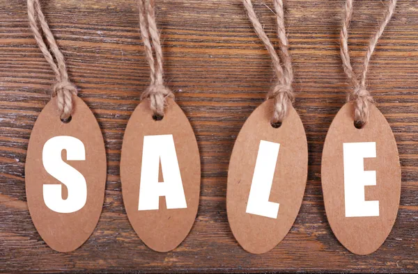 Sale tags on wood — Stock Photo, Image