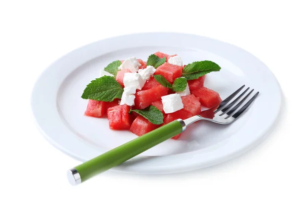 Salad with watermelon, feta and mint leaves on plate, isolated on white — Stock Photo, Image