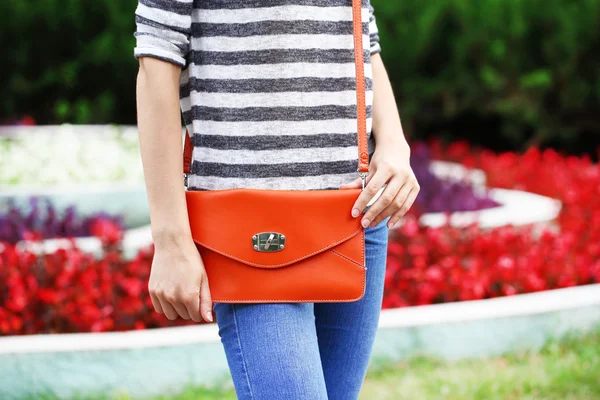 Girl with bag over his shoulder outdoors — Stock Photo, Image