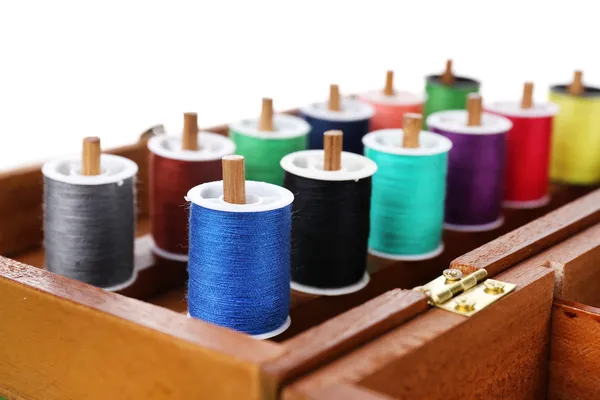 Colorful threads for needlework in wooden box close up — Stock Photo, Image