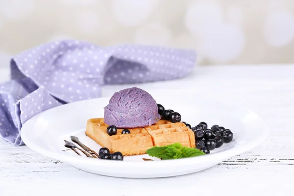 Tasty belgian waffles with ice cream on wooden table — Stock Photo, Image