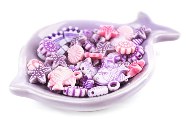 Beads for children in ceramic dish isolated on white — Stock Photo, Image