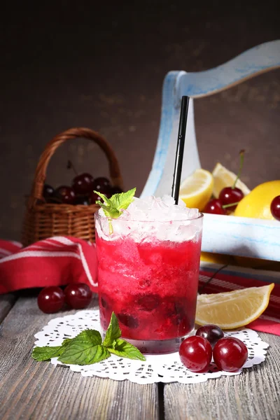 Fresh cold cherry cocktail with mint, ice and lemon — Stock Photo, Image