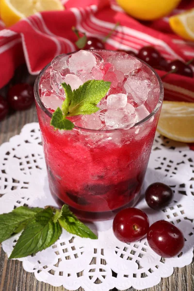 Fresh cold cherry cocktail with mint, ice and lemon — Stock Photo, Image