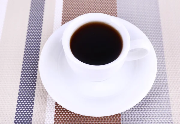 Cup of fresh hot coffee on table cloth — Stock Photo, Image