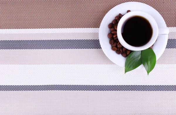 Cup of fresh hot coffee on table cloth — Stock Photo, Image