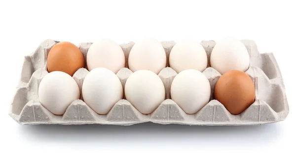 Huevos diferentes en envase de cartón aislados en blanco —  Fotos de Stock