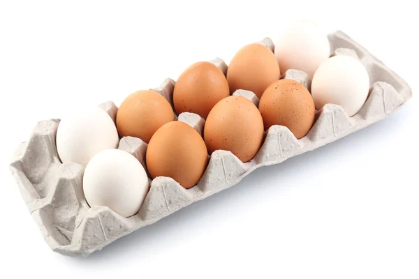 Huevos diferentes en envase de cartón aislados en blanco —  Fotos de Stock