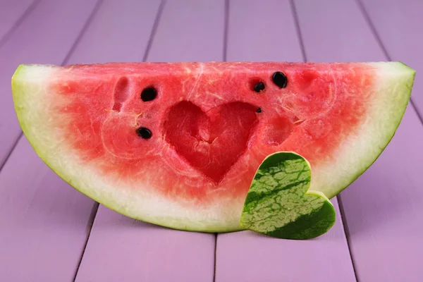 Slice of watermelon on wooden background — Stock Photo, Image