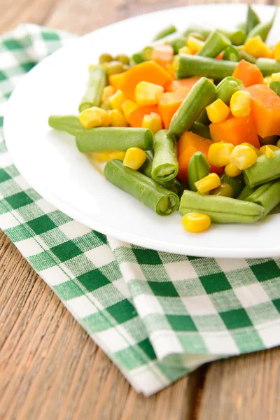 Delicious vegetables salad on plate on table close-up — Stock Photo, Image