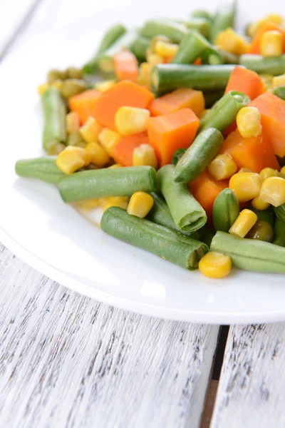 Delicious vegetables salad on plate on table close-up — Stock Photo, Image