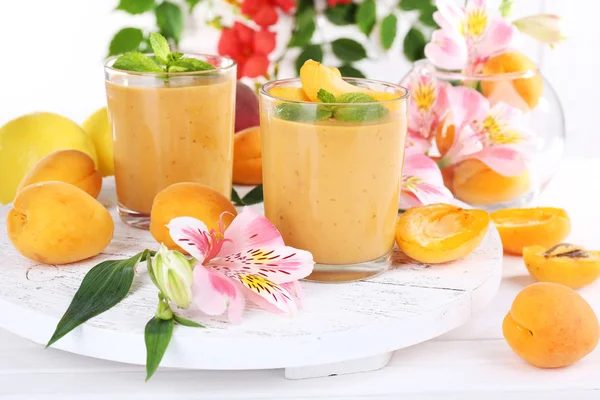 Apricot dessert in glasses on table close-up — Stock Photo, Image