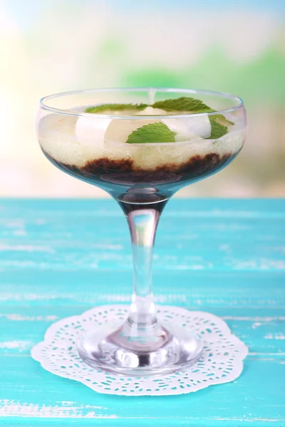 Melon smoothie in glass on table on bright background — Stock Photo, Image