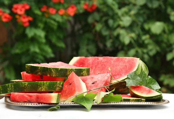 Fresh slices of watermelon on table, outdoors — Stock Photo, Image