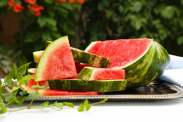 Fresh slices of watermelon on table, outdoors — Stock Photo, Image