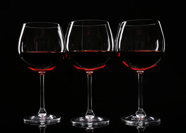 Glasses of wine isolated on black — Stock Photo, Image