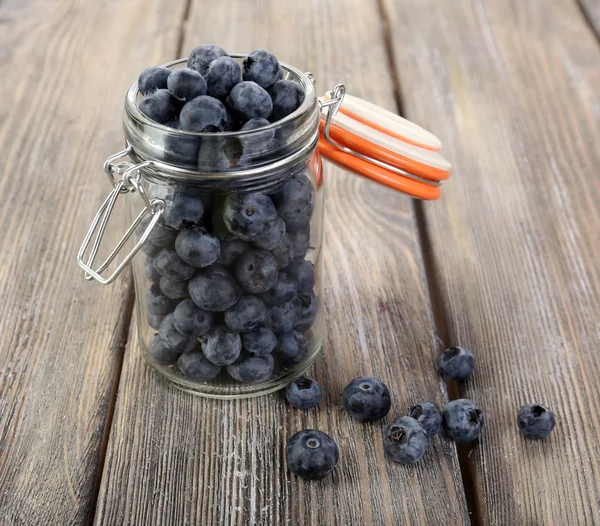 Fresh blueberries on wooden table — Stock Photo, Image