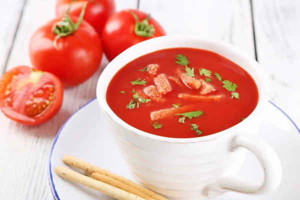 Tasty tomato soup with croutons on table close-up — Stock Photo, Image