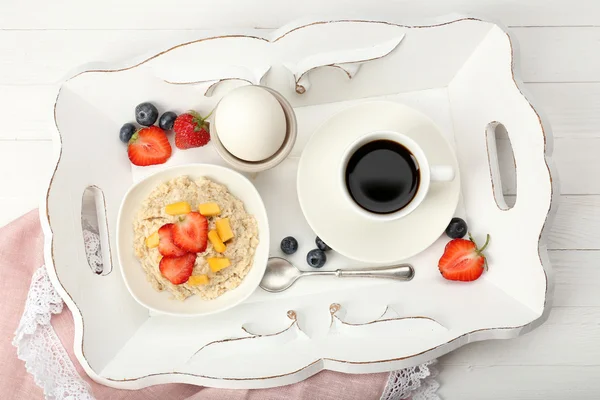 Delicious breakfast with coffee, egg and oatmeal — Stock Photo, Image