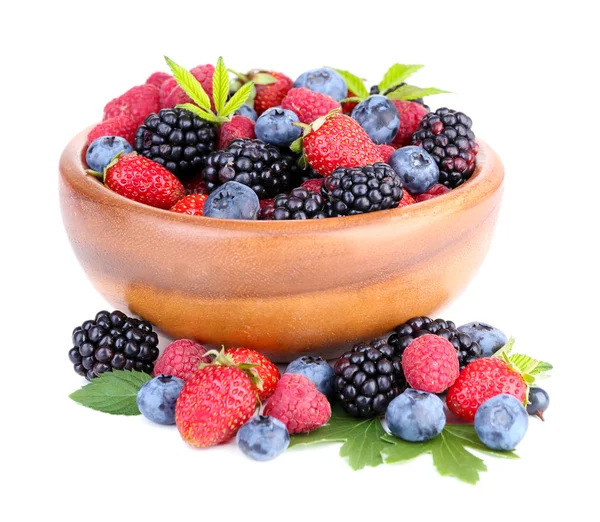 Ripe sweet different berries in wooden bowl, isolated on white — Stock Photo, Image