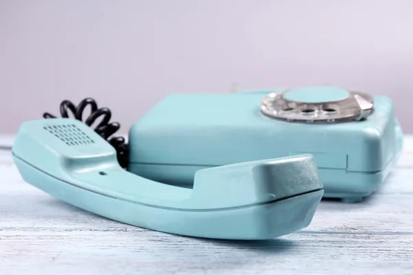 Retro turquoise telephone on wooden table, close up — Stock Photo, Image