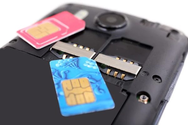 Cell phone and sim card — Stock Photo, Image