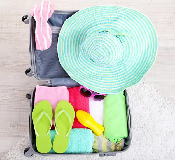 Suitcase with things for travelling — Stock Photo, Image