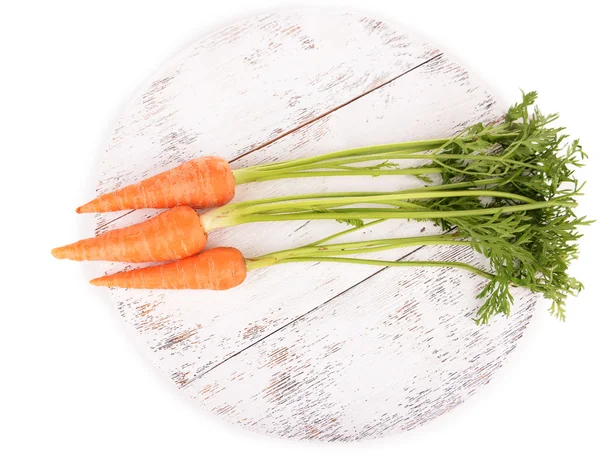 Fresh carrot on wooden stand isolated on white — Stock Photo, Image