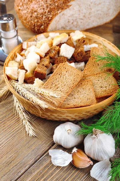 Homemade croutons on table in kitchen, close up — Stock Photo, Image