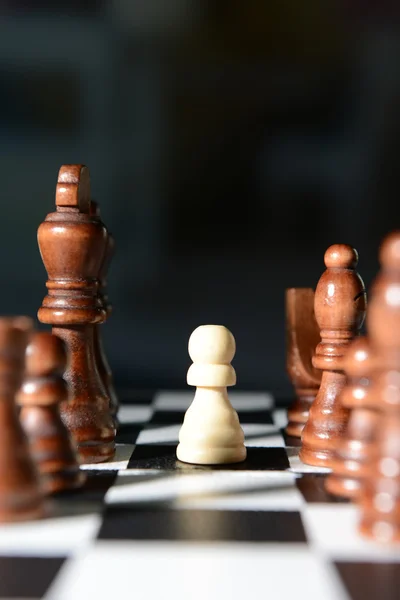 Chess board with chess pieces on dark background — Stock Photo, Image