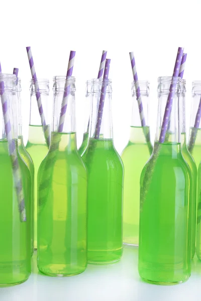 Bottles of drink with straw isolated on white — Stock Photo, Image