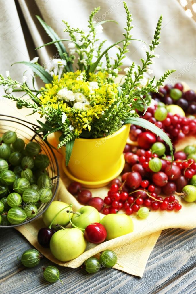 Still life with berries and flowers