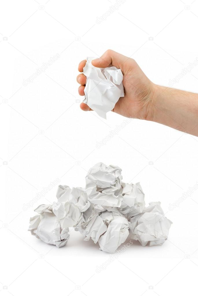 Crumpled paper and tearing up another paper ball for the pile