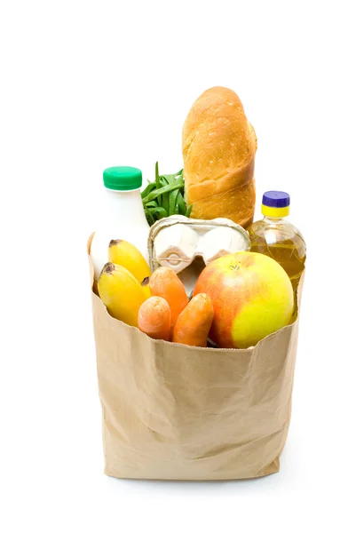 Een kruidenier zak vol gezonde groenten en fruit — Stockfoto