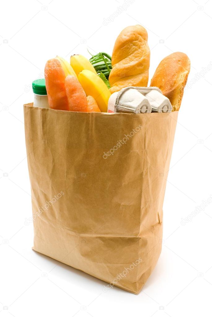 A grocery bag full of healthy fruits and vegetables